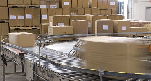 Boxes Moving on a Conveyor