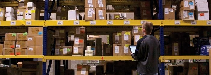 person checking warehouse inventory